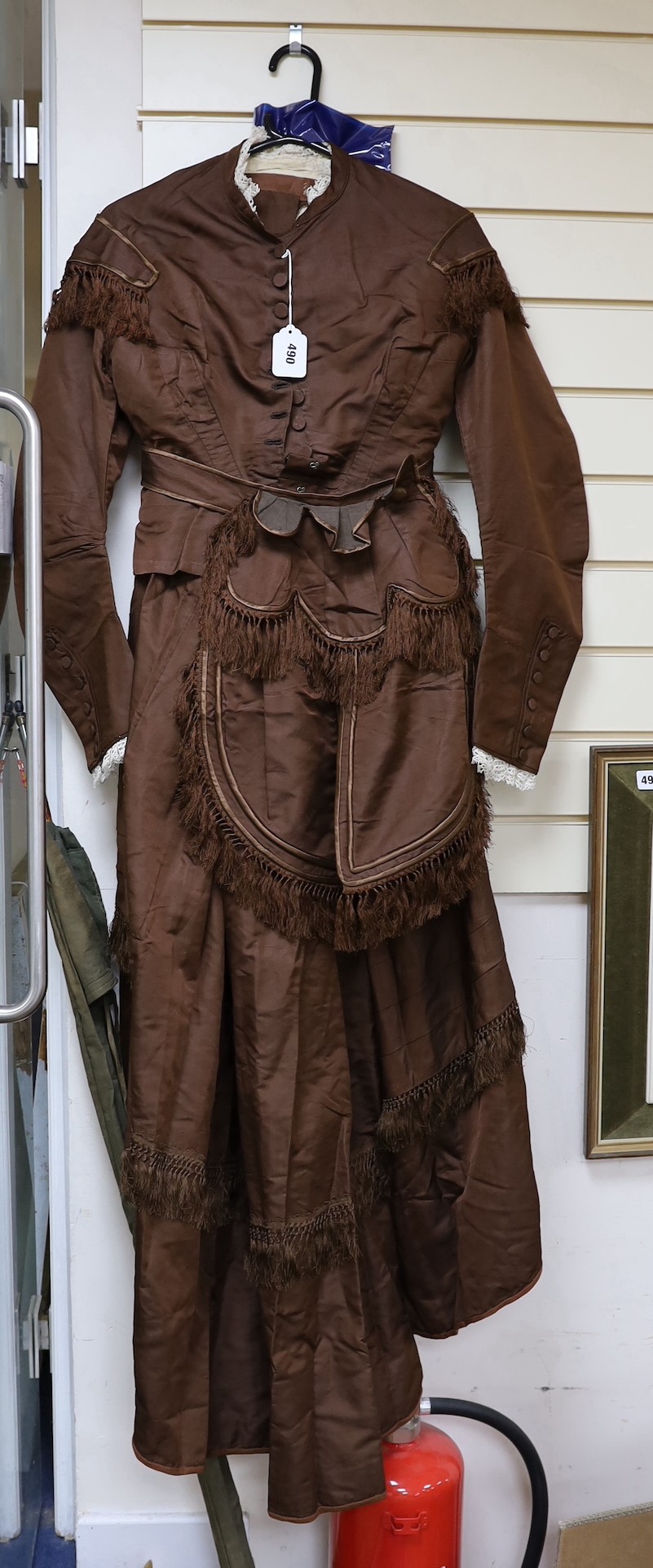 A Victorian brown silk ladies suit skirt and jacket and fronter to the skirt